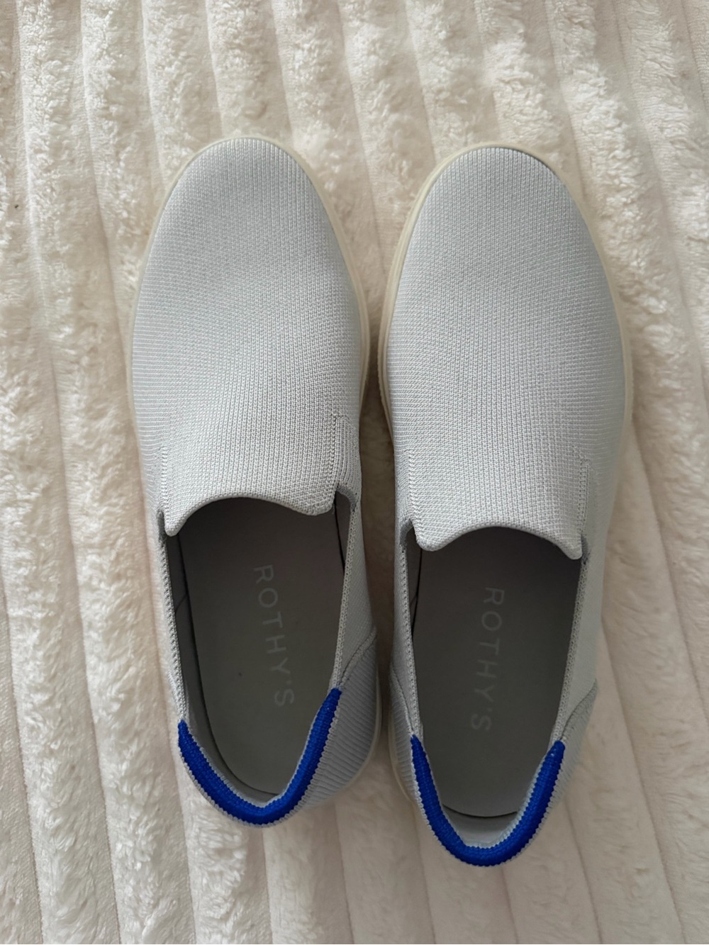 Rothy's Slip-On Sneakers in Light Gray with Blue Heel Tabs
